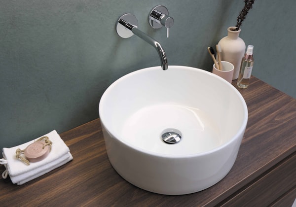Professional white ceramic sink with stainless steel faucet
